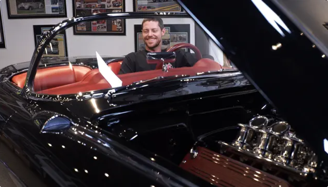 Metal fabricator Greg Hebard in a 1957 Corvette